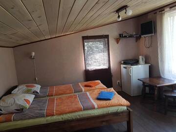 Фото номера Трехместный номер с собственной ванной комнатой Гостевой дом Atpūtas Namiņš pie jūras Saulkrasti г. Саулкрасты 11